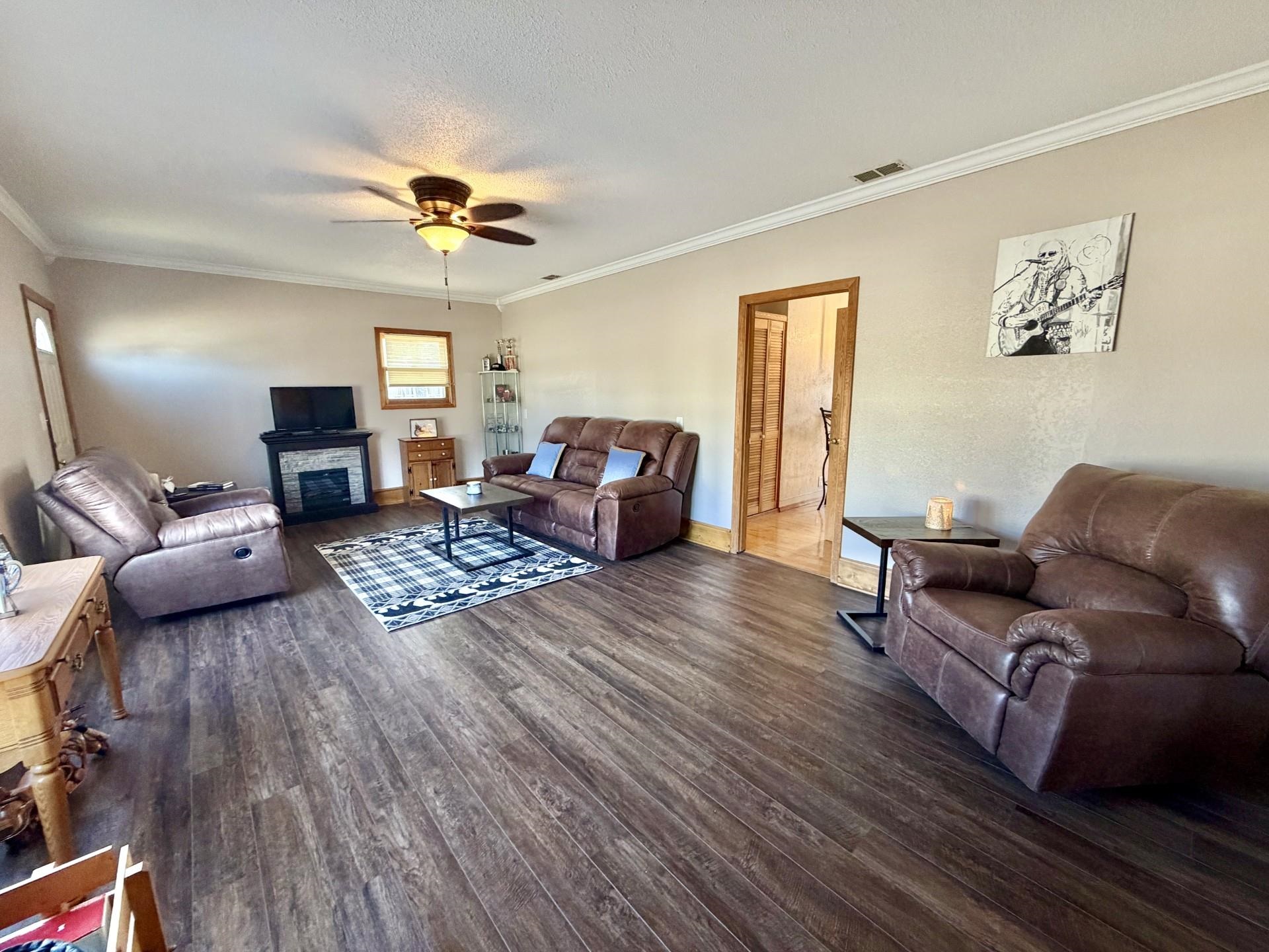 803 North Street Thomson, IL 61285 - Photo 6 of 26 a living room with furniture or couch and a wooden floor
