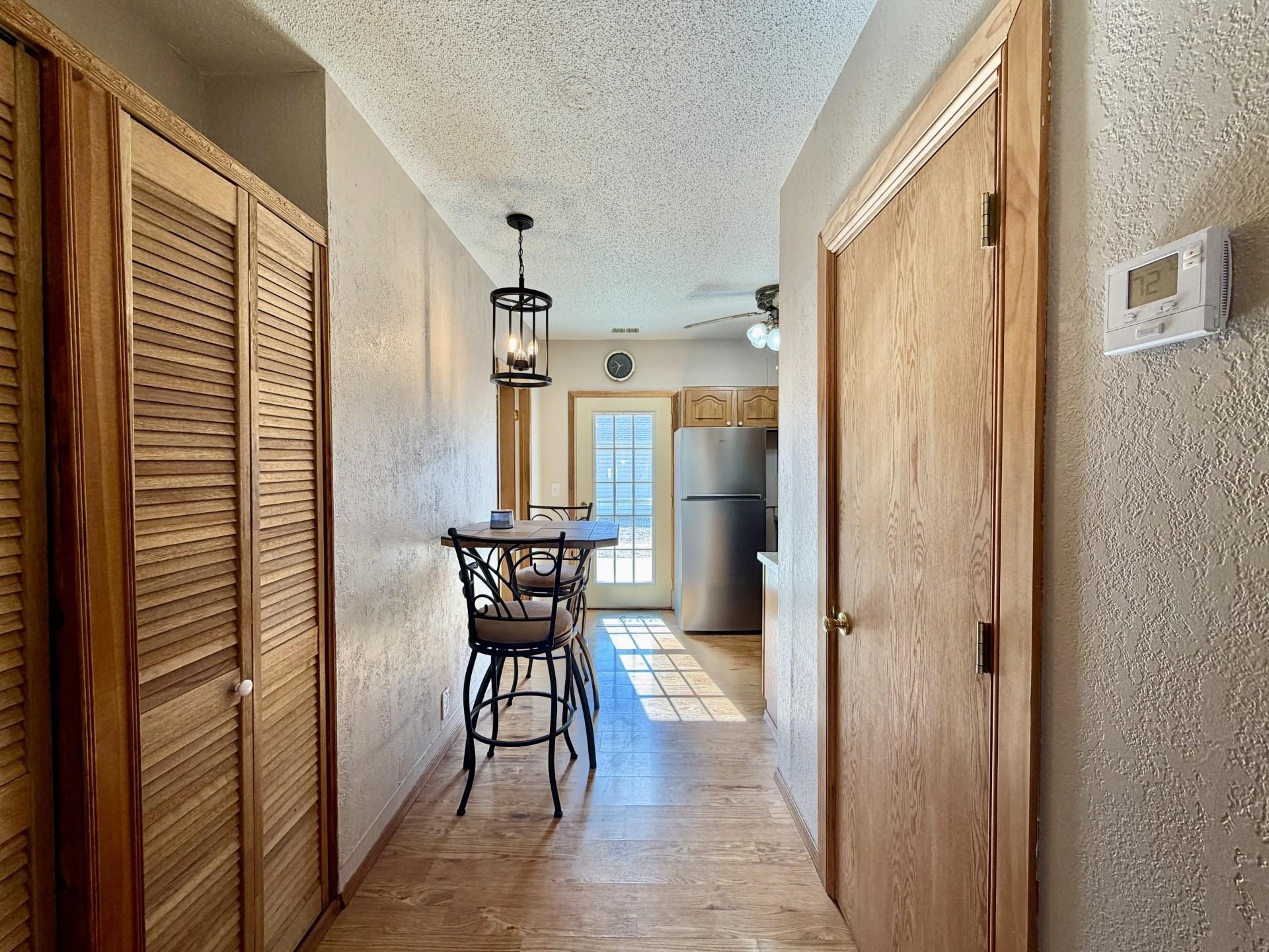 803 North Street Thomson, IL 61285 - Photo 8 of 26 a view of a hallway with chairs and door