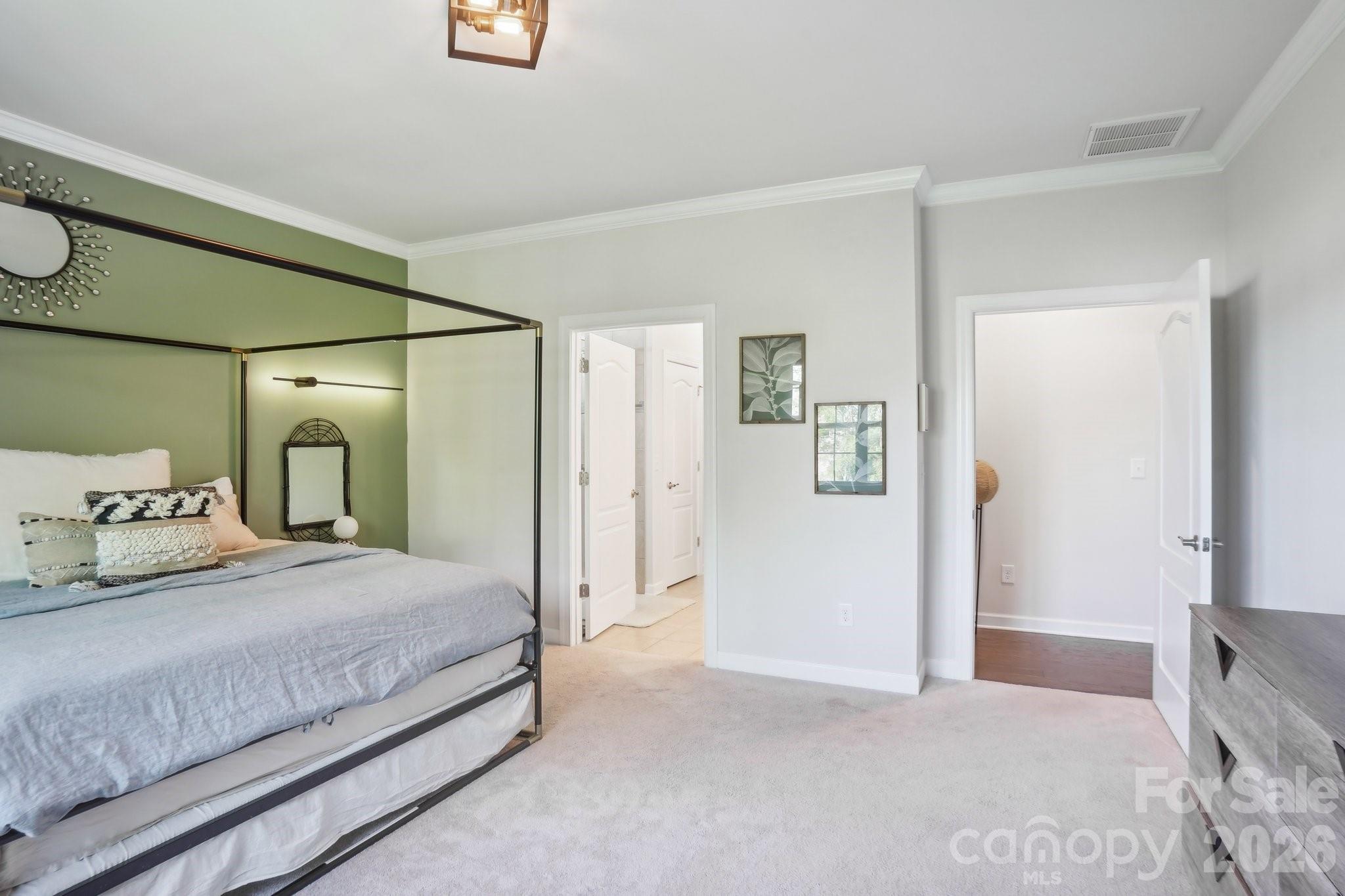 16427 Cozy Cove Road Charlotte, NC 28278 - Photo 14 of 47 a bedroom with a bed and a mirror