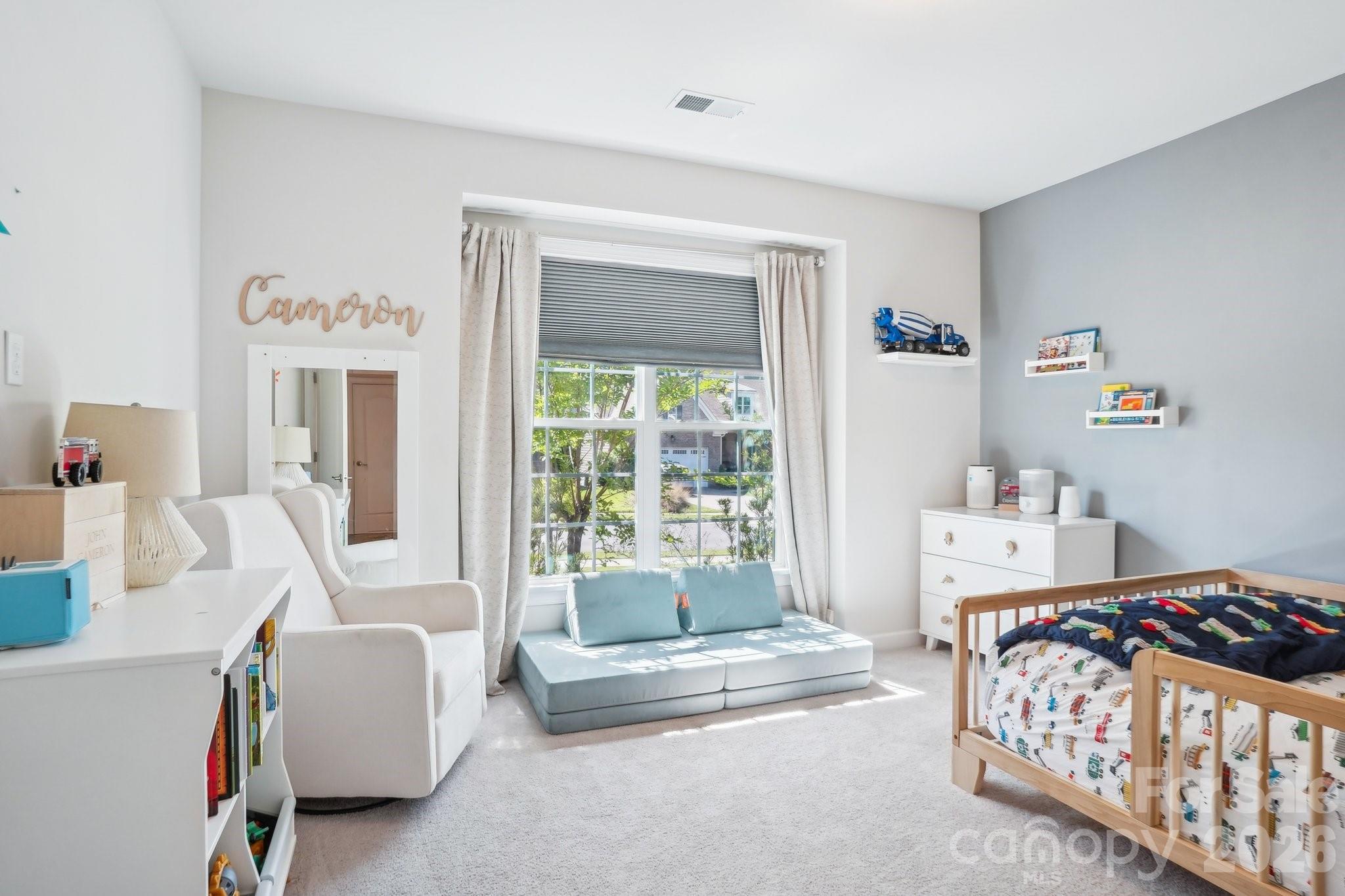 16427 Cozy Cove Road Charlotte, NC 28278 - Photo 19 of 47 a bedroom with a bed and a couch