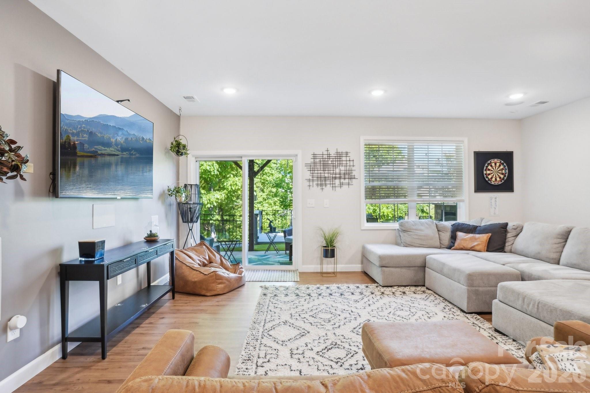 16427 Cozy Cove Road Charlotte, NC 28278 - Photo 20 of 47 a living room with furniture and a large window