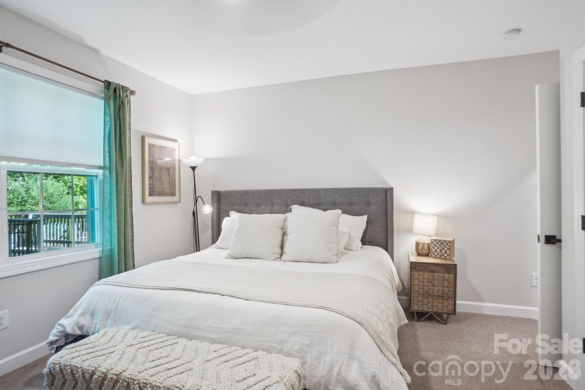 16427 Cozy Cove Road Charlotte, NC 28278 - Photo 28 of 47 a bedroom with a bed and a window