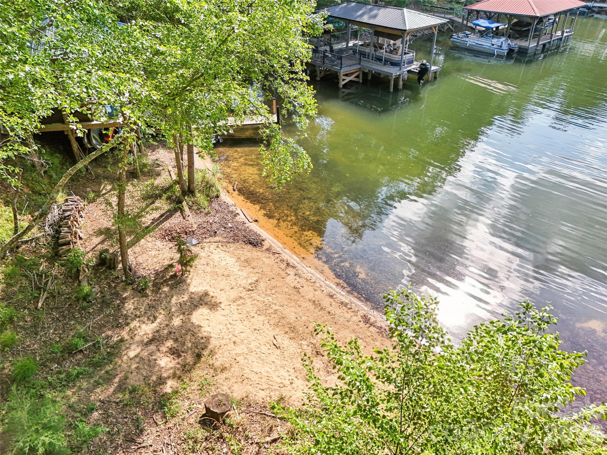 16427 Cozy Cove Road Charlotte, NC 28278 - Photo 3 of 47 a view of a lake with a house in the background
