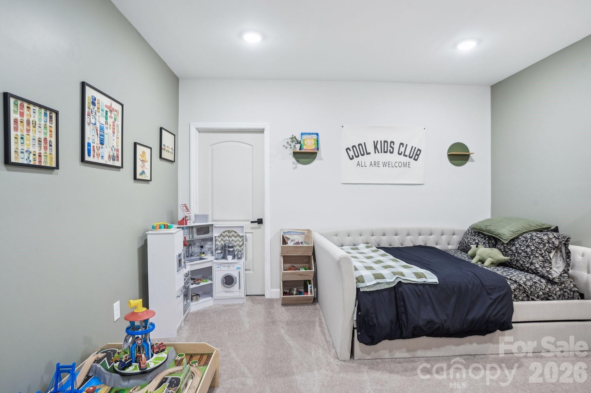 16427 Cozy Cove Road Charlotte, NC 28278 - Photo 31 of 47 a bedroom with furniture and a wooden floor