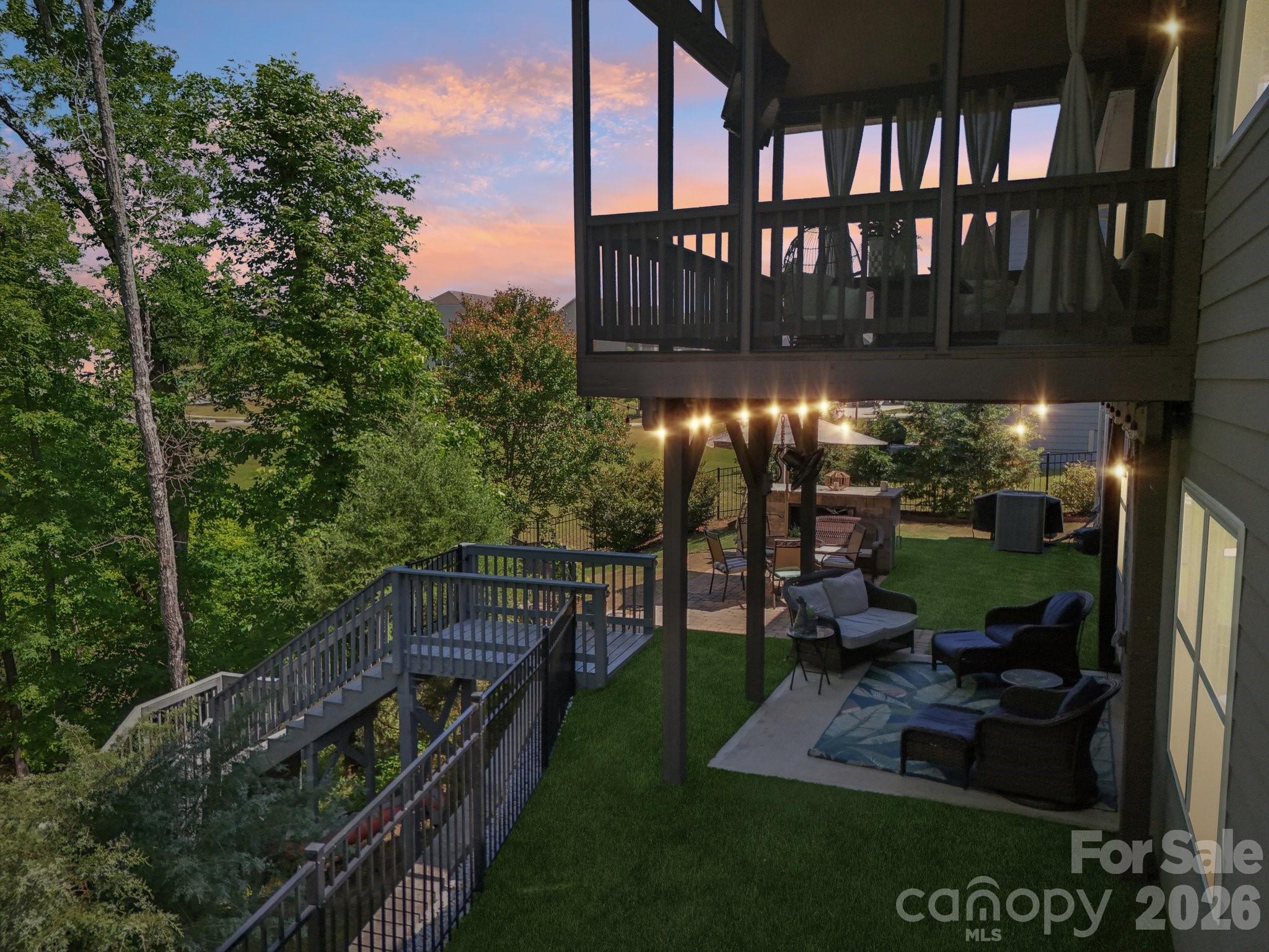 16427 Cozy Cove Road Charlotte, NC 28278 - Photo 35 of 47 a view of a chairs and table in backyard