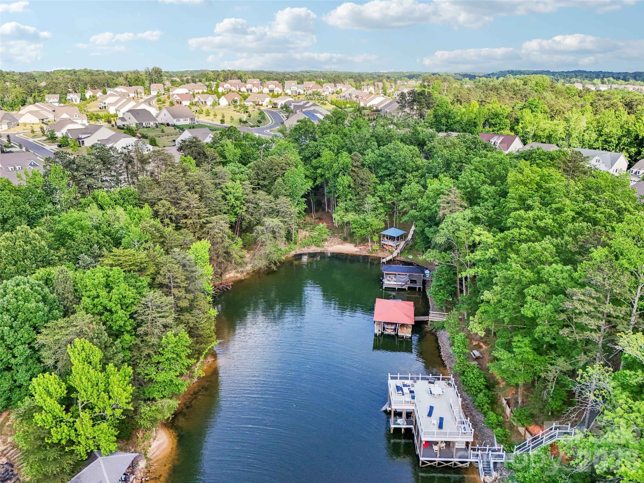 16427 Cozy Cove Road Charlotte, NC 28278 - Photo 43 of 47 an aerial view of a house with a yard and lake view