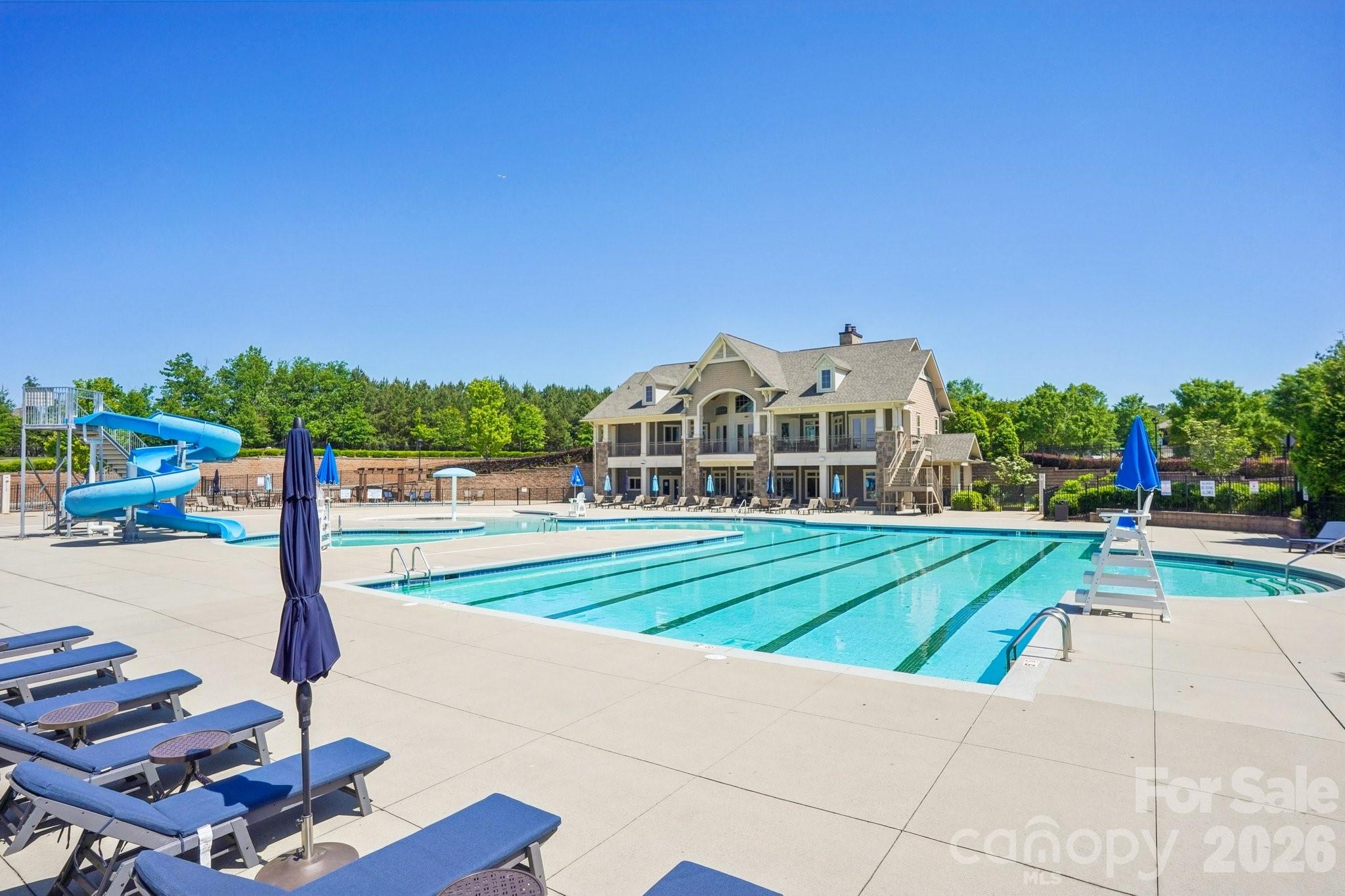 16427 Cozy Cove Road Charlotte, NC 28278 - Photo 47 of 47 a view of a white house with a big yard and large trees