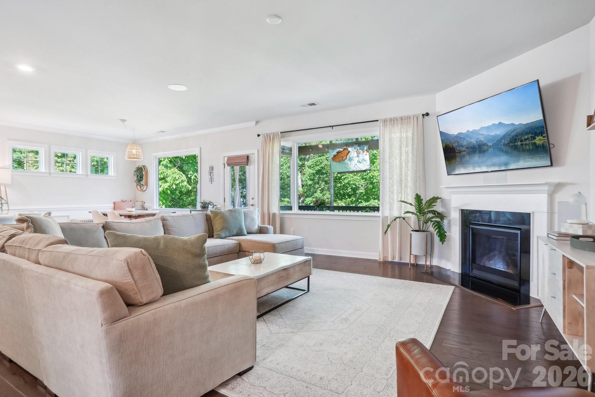 16427 Cozy Cove Road Charlotte, NC 28278 - Photo 7 of 47 a living room with furniture and a fireplace