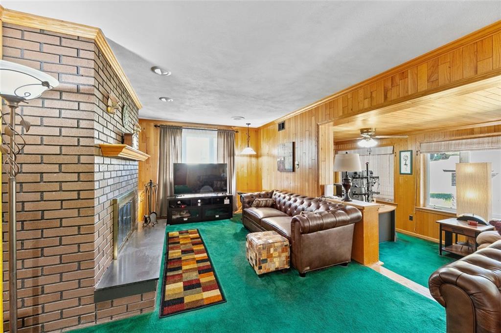 5920 Lee Street Export, PA 15632 - Photo 16 of 43 a living room with furniture and a fireplace