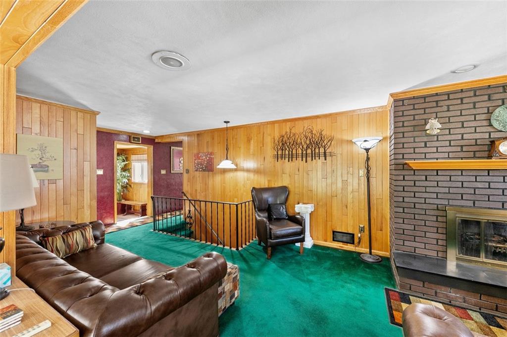 5920 Lee Street Export, PA 15632 - Photo 19 of 43 a living room with furniture and a fireplace