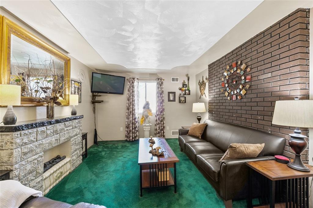 5920 Lee Street Export, PA 15632 - Photo 24 of 43 a living room with furniture and a flat screen tv