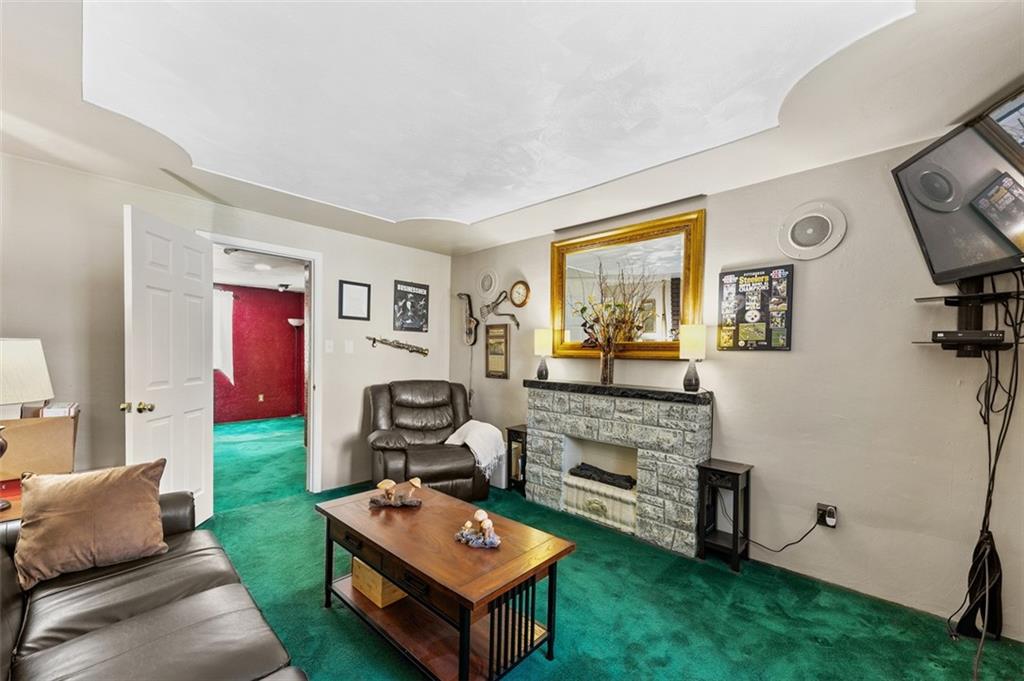 5920 Lee Street Export, PA 15632 - Photo 25 of 43 a living room with furniture and a flat screen tv