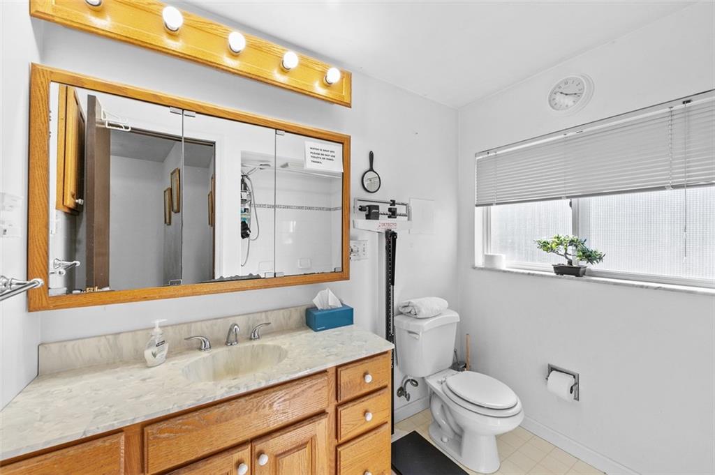 5920 Lee Street Export, PA 15632 - Photo 31 of 43 a bathroom with a granite countertop sink mirror vanity and toilet