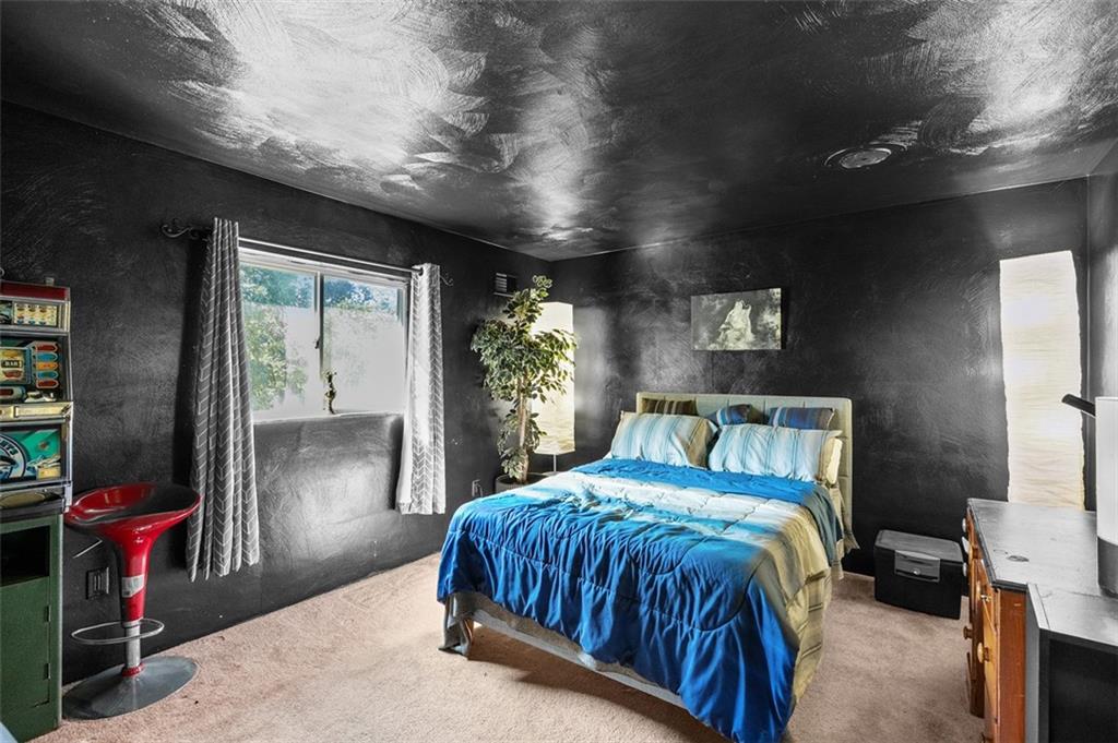 5920 Lee Street Export, PA 15632 - Photo 33 of 43 a bed sitting in a bedroom next to a window