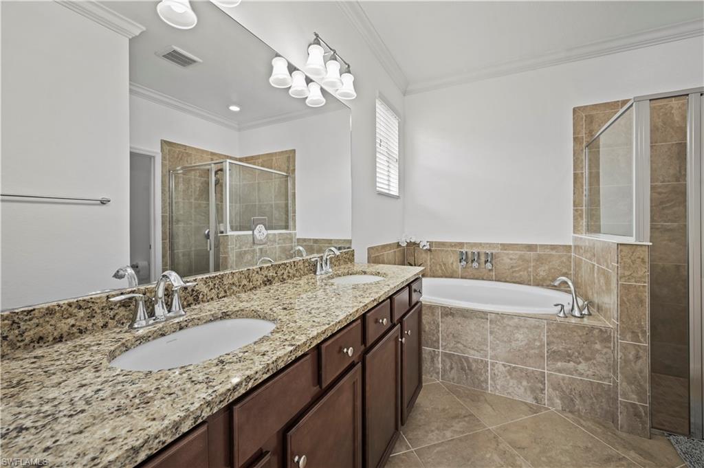 17549 Timberline Parkway Babcock Ranch, FL 33982 - Photo 16 of 39 a bathroom with a granite countertop double vanity sink and a mirror