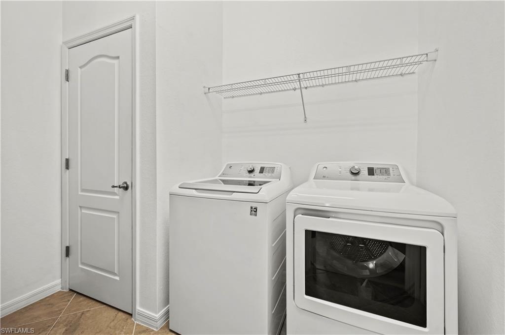17549 Timberline Parkway Babcock Ranch, FL 33982 - Photo 23 of 39 a utility room with dryer and washer
