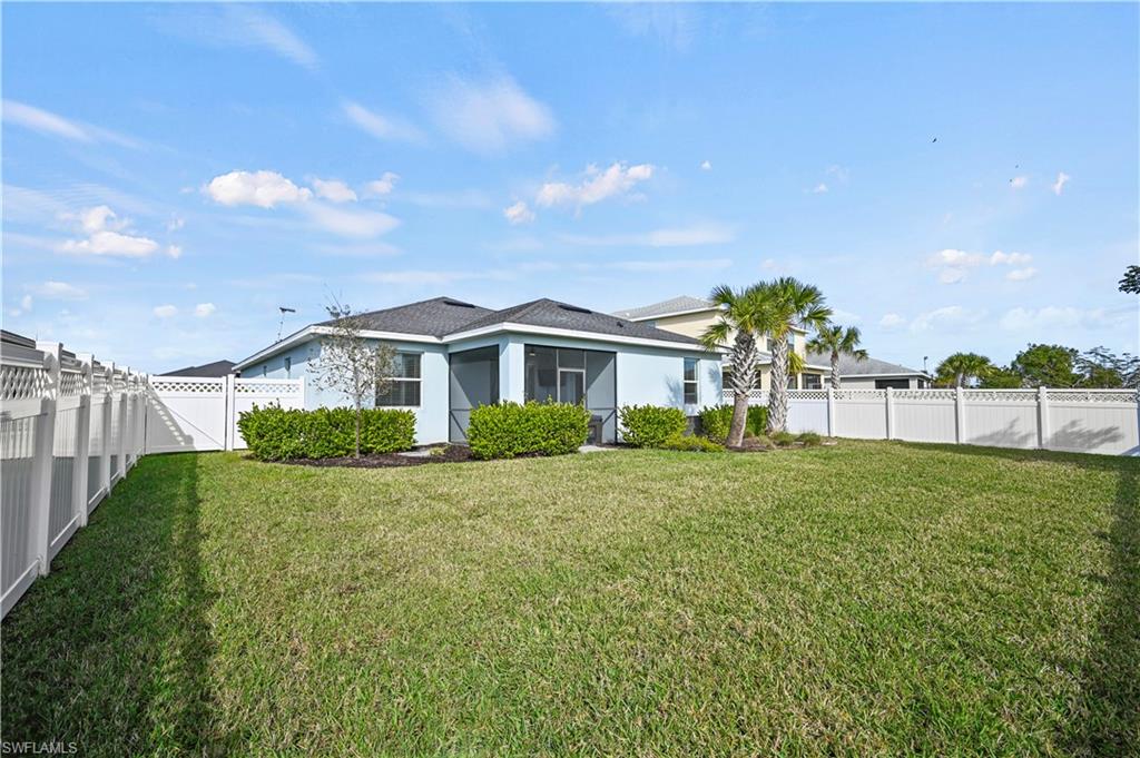 17549 Timberline Parkway Babcock Ranch, FL 33982 - Photo 30 of 39 a front view of a house with a yard