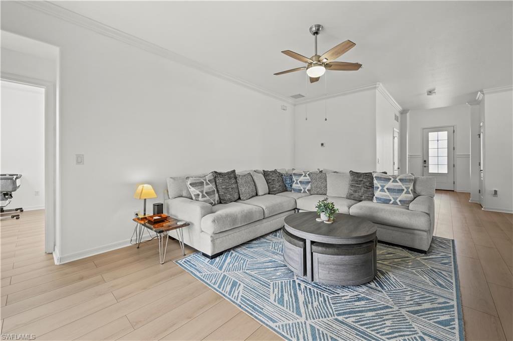 17549 Timberline Parkway Babcock Ranch, FL 33982 - Photo 4 of 39 a living room with furniture and white walls