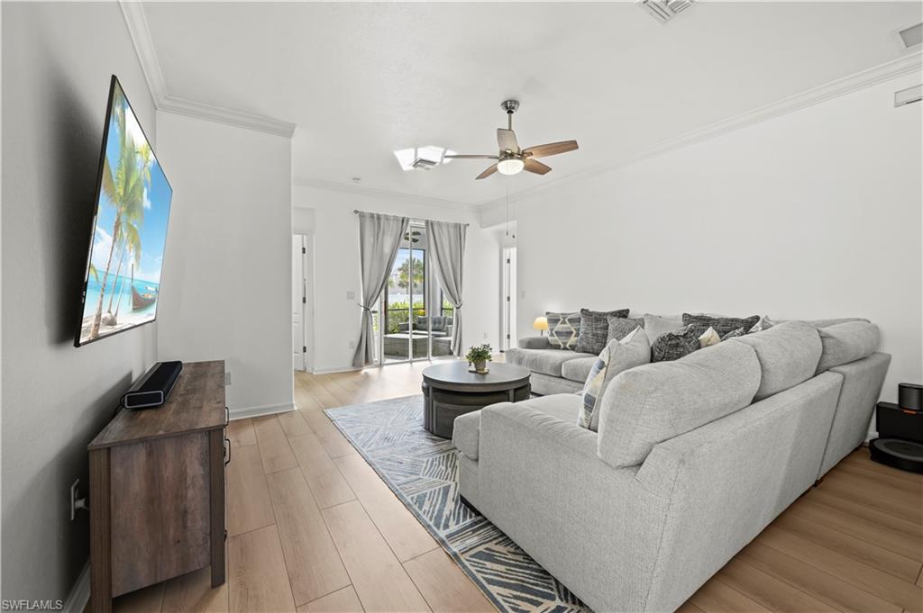17549 Timberline Parkway Babcock Ranch, FL 33982 - Photo 5 of 39 a living room with furniture and a large window