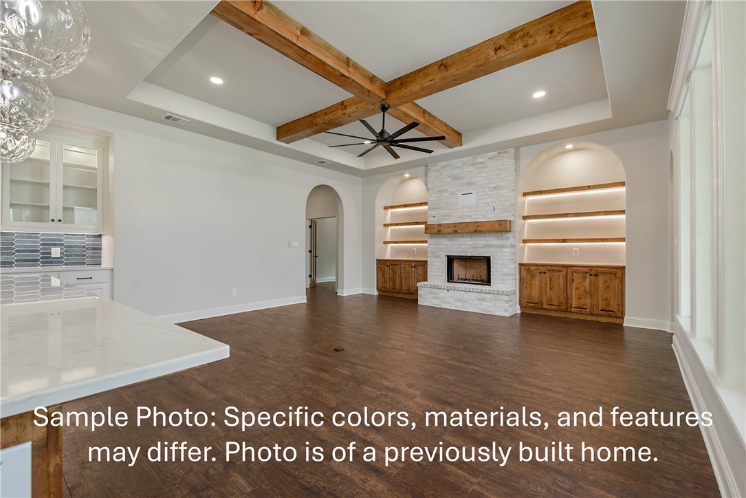 4027 Pacific Crest Way Bryan, TX 77802 - Photo 2 of 23 a view of a livingroom with a fireplace a ceiling fan and front door
