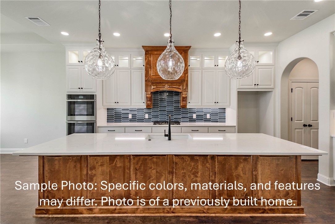 4027 Pacific Crest Way Bryan, TX 77802 - Photo 4 of 23 a view of a kitchen with granite countertop couches a fireplace and kitchen view