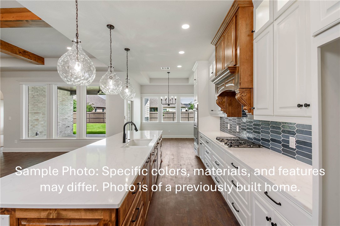 4027 Pacific Crest Way Bryan, TX 77802 - Photo 5 of 23 a view of kitchen with granite countertop stove top oven