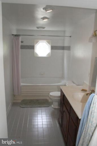 5112 South Rolling Road Halethorpe, MD 21227 - Photo 22 of 30 a bathroom with a sink a toilet and shower