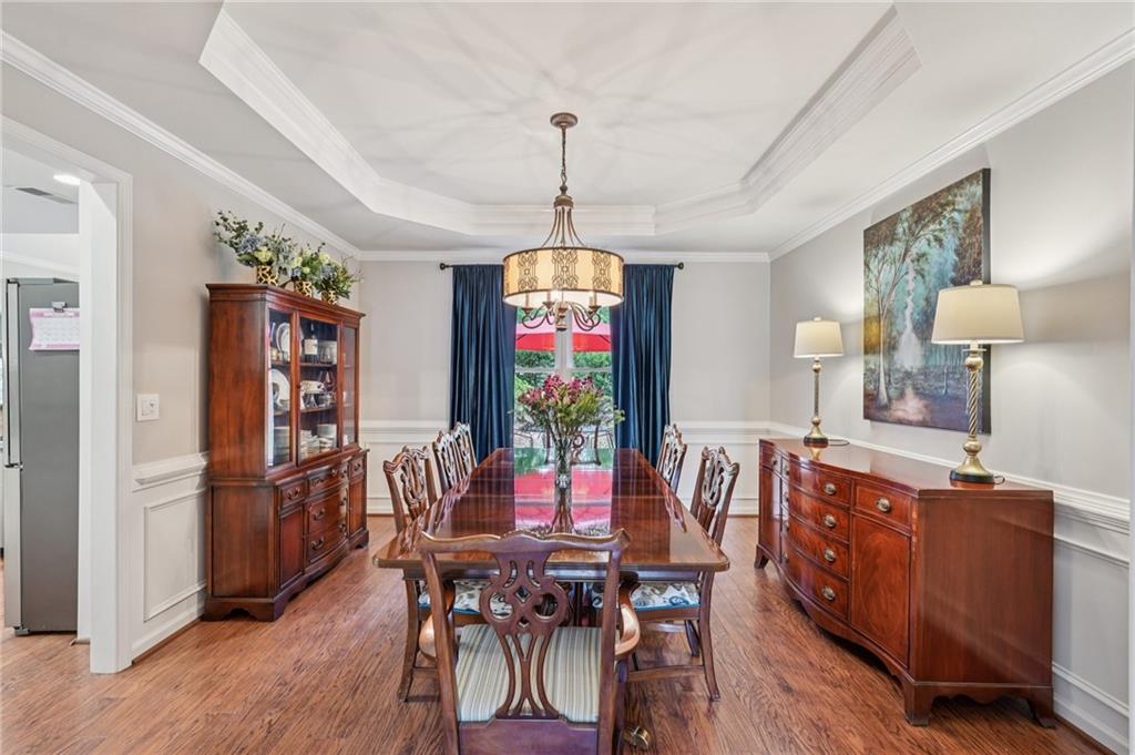 3820 Ridge Point Drive Suwanee, GA 30024 - Photo 16 of 41 a view of a dining room with furniture window and wooden floor