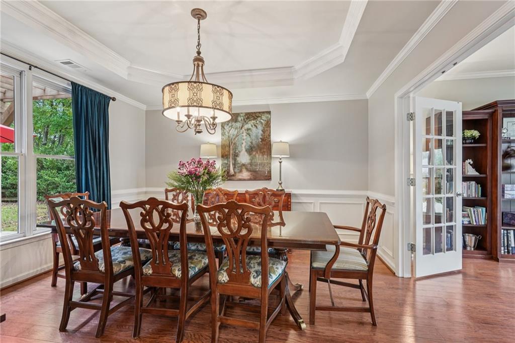3820 Ridge Point Drive Suwanee, GA 30024 - Photo 17 of 41 a view of a dining room with furniture window and outside view