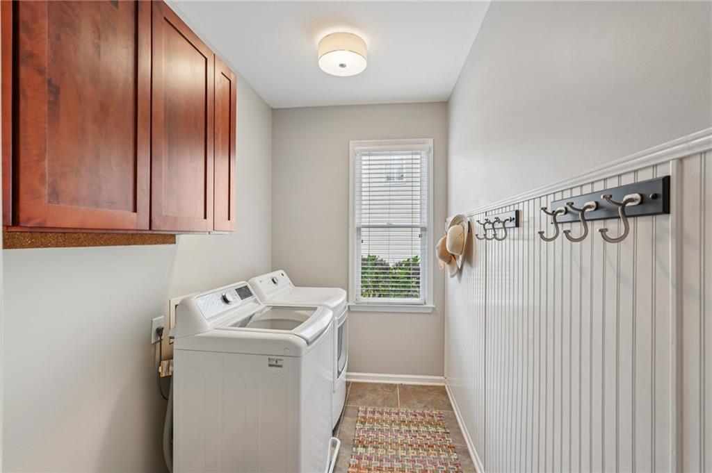 3820 Ridge Point Drive Suwanee, GA 30024 - Photo 22 of 41 a bathroom with a sink a toilet and shower