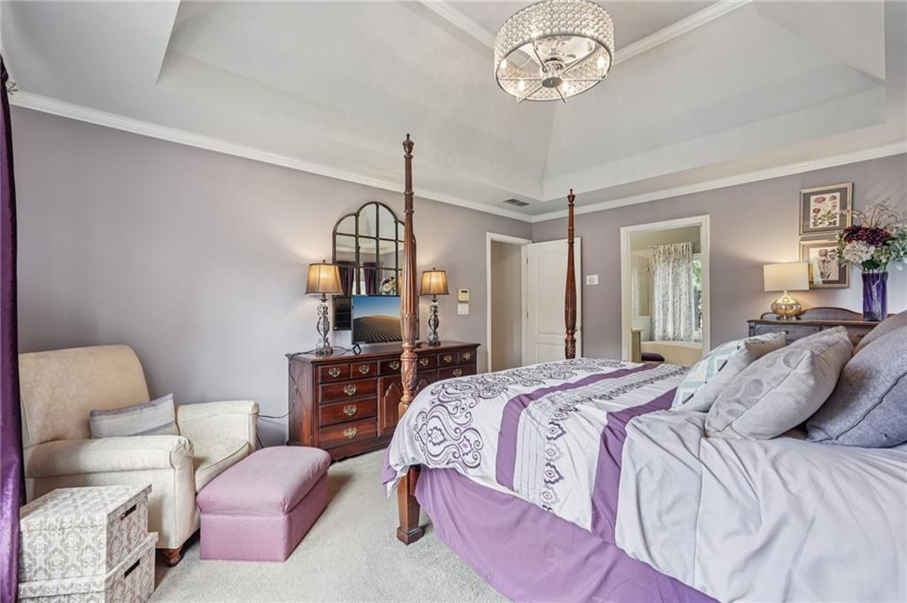 3820 Ridge Point Drive Suwanee, GA 30024 - Photo 27 of 41 a bedroom with a bed furniture and window