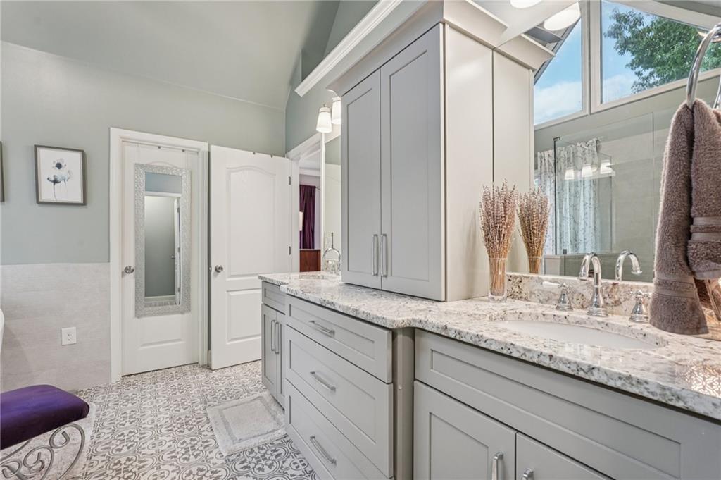 3820 Ridge Point Drive Suwanee, GA 30024 - Photo 31 of 41 a bathroom with a granite countertop sink and a mirror