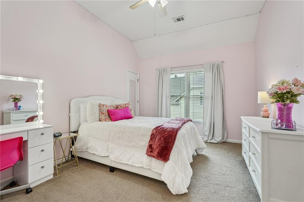 3820 Ridge Point Drive Suwanee, GA 30024 - Photo 33 of 41 a bedroom with a bed and a window