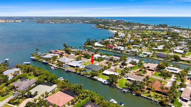an aerial view of a city with ocean view