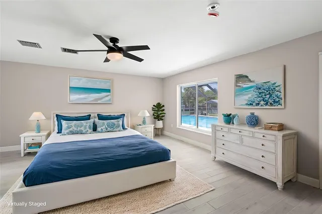 a bedroom with a large bed and a window