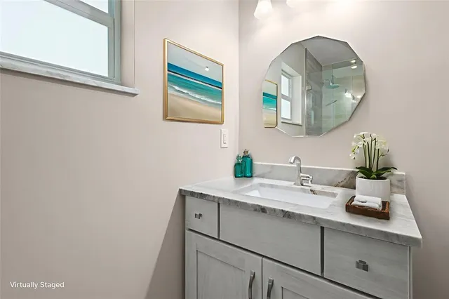 a bathroom with a sink and a mirror
