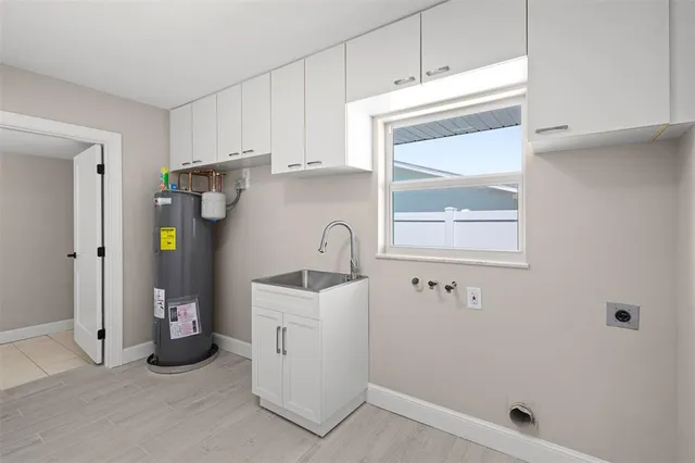 a kitchen with a refrigerator and window