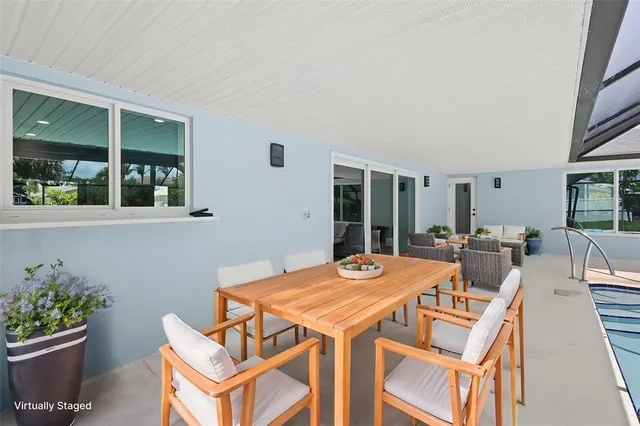a view of a dining room with furniture window and outside view