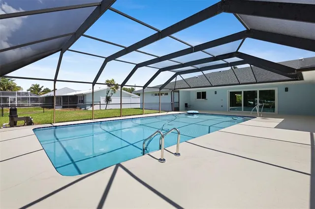 a view of a swimming pool with a lounge chairs