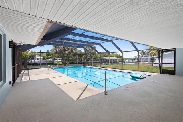 a view of a house with a backyard porch and sitting area