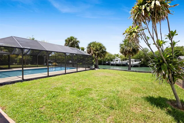 an aerial view of a tennis ground and a residential houses