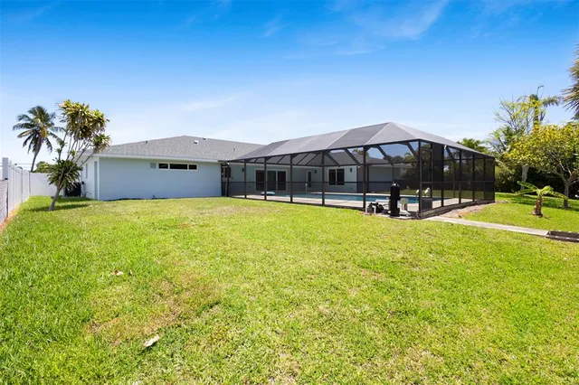 an aerial view of residential houses with outdoor space and river