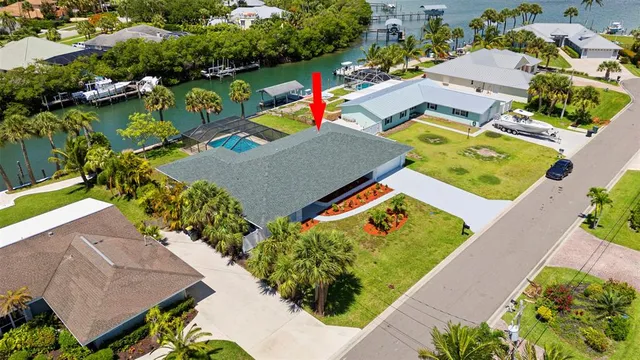 an aerial view of a city with lots of residential buildings lake and ocean view