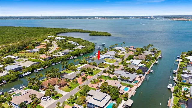 an aerial view of residential house with outdoor space and swimming pool