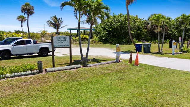 a view of a room with wooden floor cabinet and windows