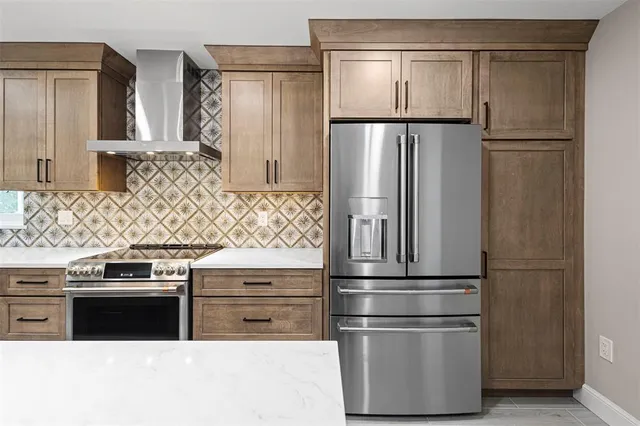 a kitchen with appliances and cabinets