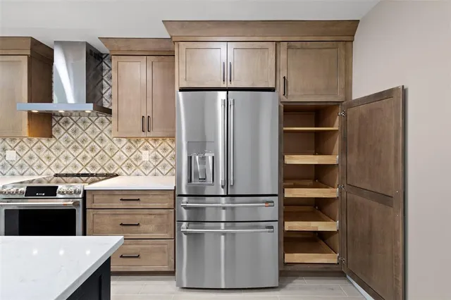 a kitchen with appliances cabinets and a counter top space
