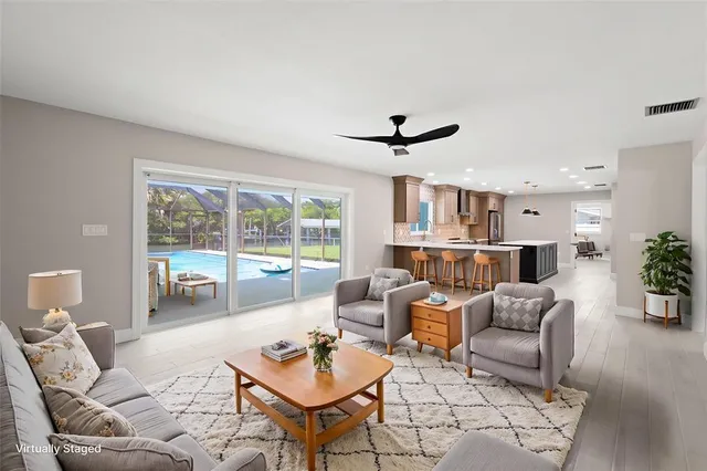 a living room with furniture and a large window