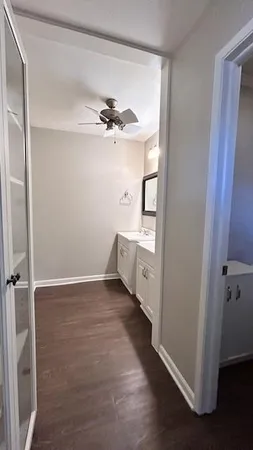 wooden floor in an empty room with a mirror