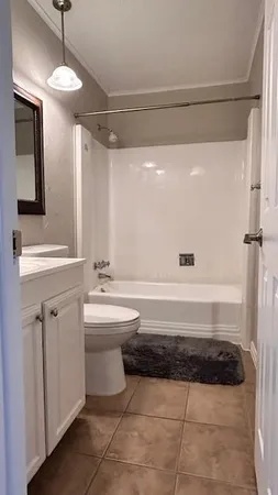 a bathroom with a sink a mirror and a bathtub